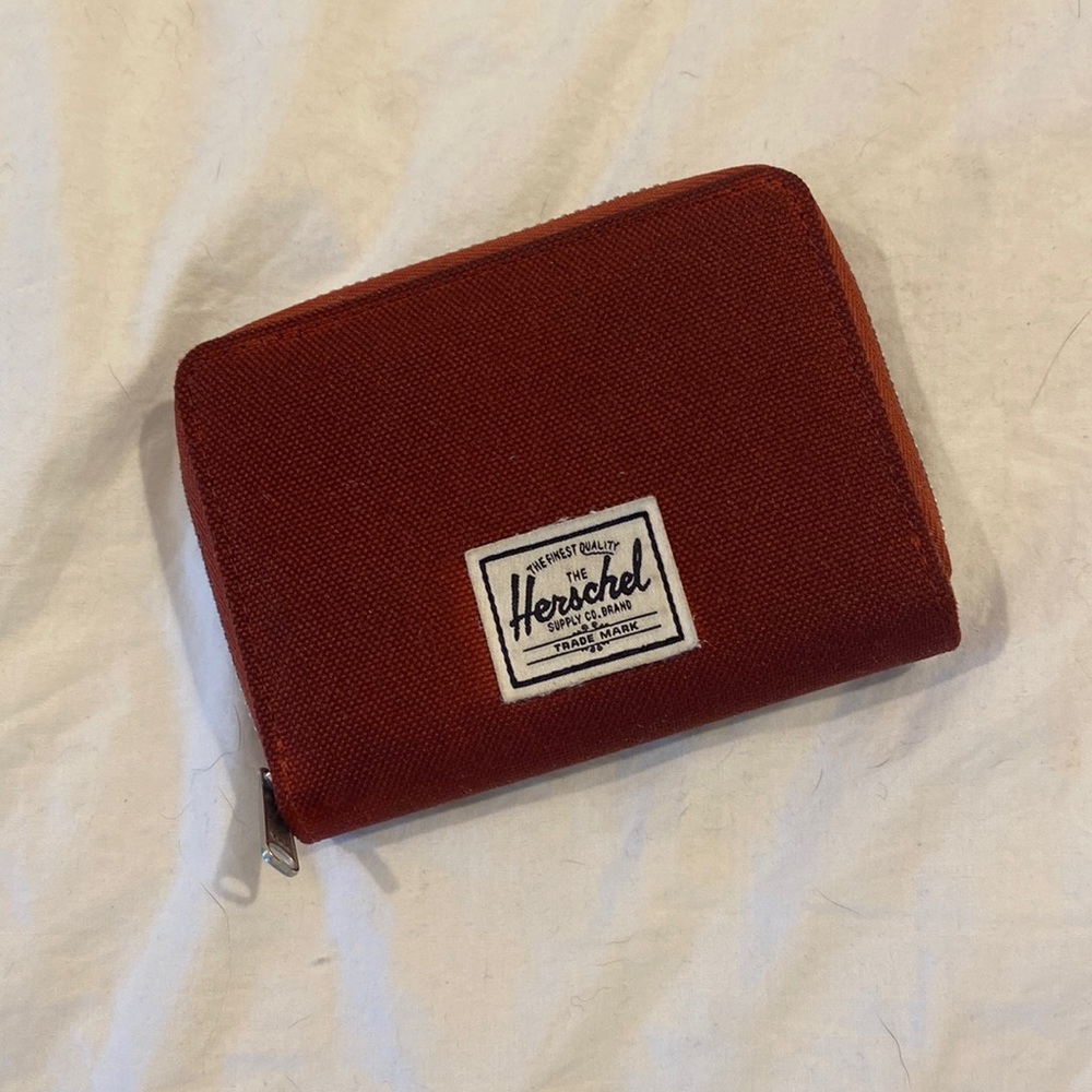 This rusty red Hershel wallet is almost new.